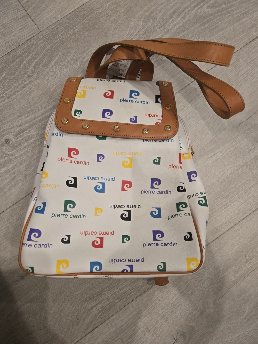 Pierre Cardin White Backpack with Tan Trim and Multicolor Logo